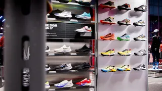Sneaker store display with shoes on shelves