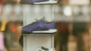 Sneaker collection displayed on shelf