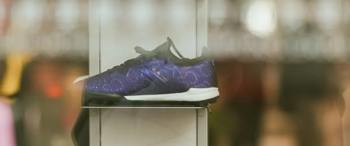 Sneaker collection displayed on shelf